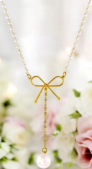 Graceful Bow Necklace with Faux Pearl Accent